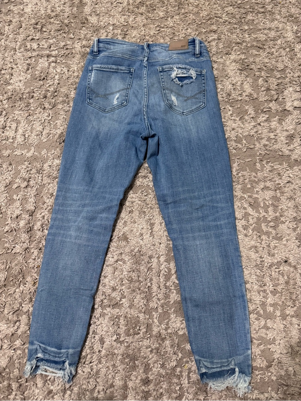 BKE Women’s Light Blue Skinny Jeans with Distressed Hems